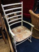 A white ladder back rocking chair