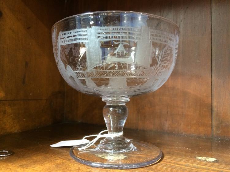 A glass engraved with the Swing and High Level Bridges
