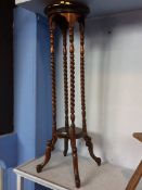 A reproduction mahogany pedestal