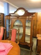 An Edwardian inlaid mahogany china cabinet