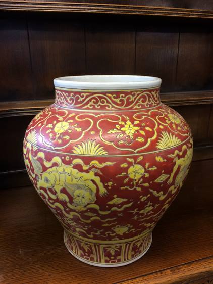 A large Oriental vase decorated with lions