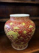 A large Oriental vase decorated with lions