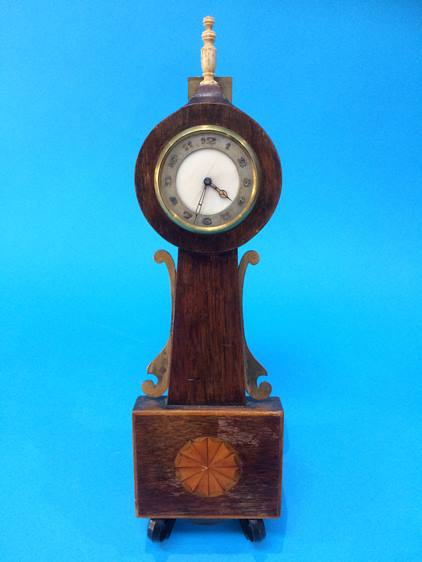 A miniature mahogany mounted clock