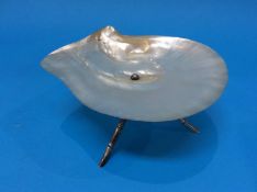 A Mother of Pearl dish mounted on silver metal simulated bamboo legs