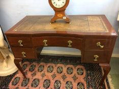 An Edwardian ladies writing desk with inset leather top