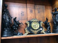 Two pairs of Spelter figures and a mantle clock