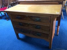 Two Edwardian walnut straight front chest of drawers