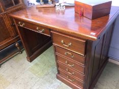 A reproduction mahogany desk