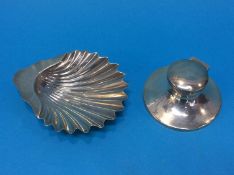 A silver shell ashtray and a silver capstan ink well