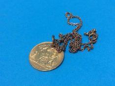 A 1/2 sovereign ,mounted as a necklace on a yellow metal chain