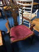 An inlaid Edwardian mahogany armchair