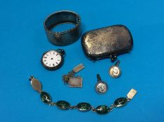 A silver purse and bangle etc.