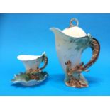 A Franz giraffe tea cup and saucer and matching tea pot (boxed)