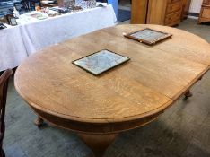 An extending oak dining table