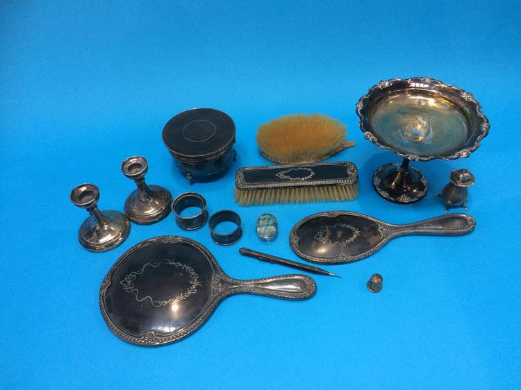 A part silver and tortoishell brush set, various silver napkin rings and a 'Sterling' taza etc.