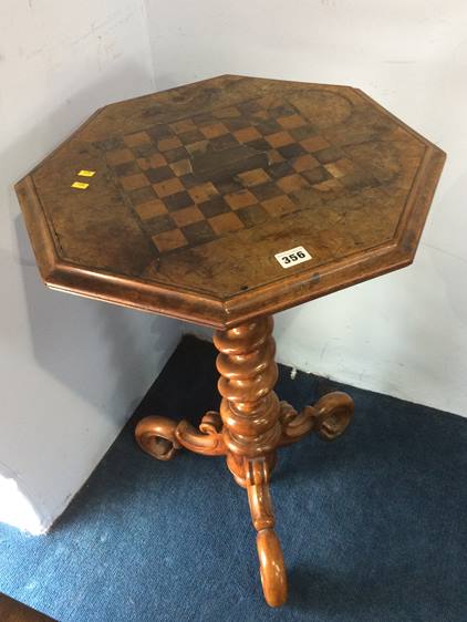 A Victorian octagonal walnut games table