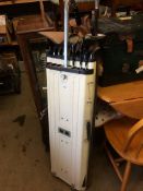 Golf clubs in case and fencing foil