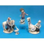 Three Lladro figure groups and a Nao figure group (4)