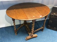 An oak barley twist gateleg dining table