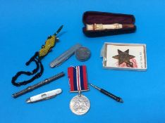 Bag of assorted including a silver knife, cheroot holder and medals etc.