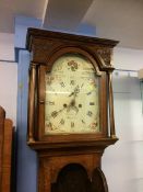 An oak cased long case clock , eight day movement, painted dials, signed Thomas Peasfor (?) Berwick