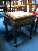 A carved hardwood Oriental plant stand with marble top, 38 x 38 x 48cm