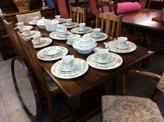 An oak eight piece dining room suite, comprising six chairs (4+2), refectory table and dresser