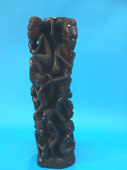 A carved African hardwood figure group