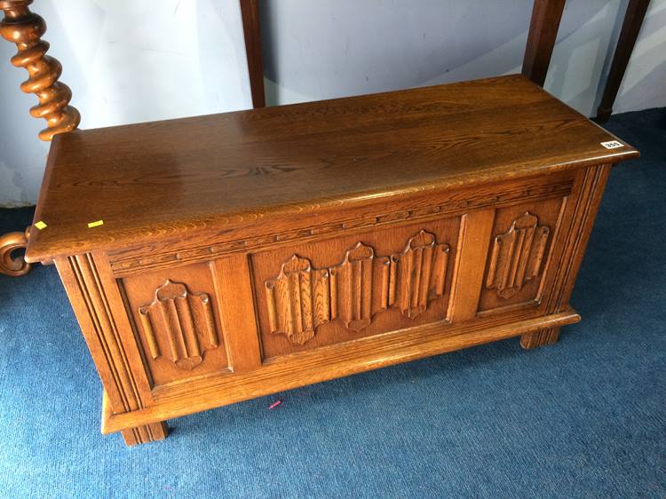 An oak linen fold blanket box