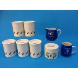 Six Carlton ware Guinness storage jars, a water jug and a mug