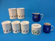 Six Carlton ware Guinness storage jars, a water jug and a mug