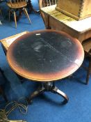 A lacquered Victorian occasional table with gilt decoration