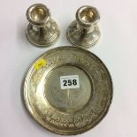 Pair of silver dwarf candlesticks and a silver dish