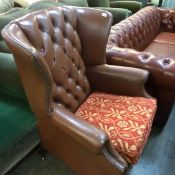 Brown Chesterfield armchair