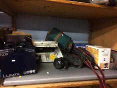 Shelf of assorted camera equipment