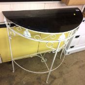 Metalwork half moon table and a kitchen cabinet