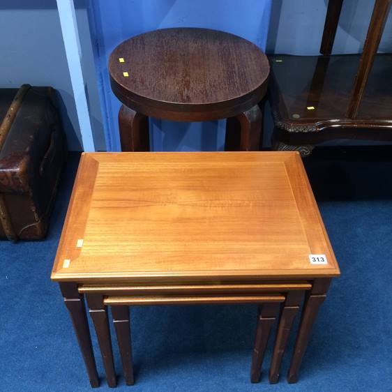 Circular table and a nest of tables