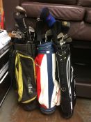 Three sets of golf clubs