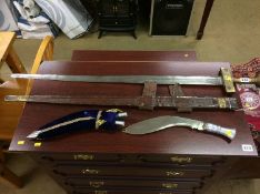 Sword with leather scabbard and a Kukhri