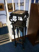 A carved Oriental hardwood plant stand, with inset marble top