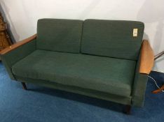 A teak two seater sofa bed