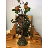 A figural table lamp