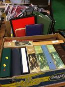 Two boxes of postcard albums