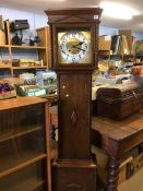 An oak long case clock, with eight day movement