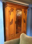 An Edwardian single door wardrobe