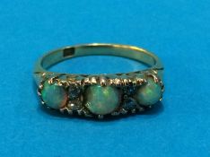 An opal and diamond ring, stamped '18', size M/N, 3.8 grams