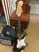Fender amp and a Squier Strat electric guitar