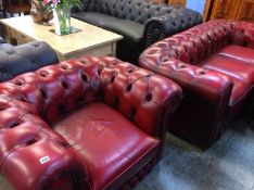 An Oxblood Chesterfield settee and matching tub chair