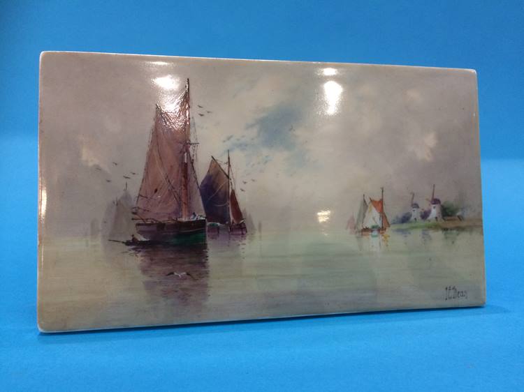 A small porcelain plaque decorated with sailing vessels and windmills, signed ** Dean, 10cm x 18cm