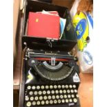 An Imperial typewriter and records